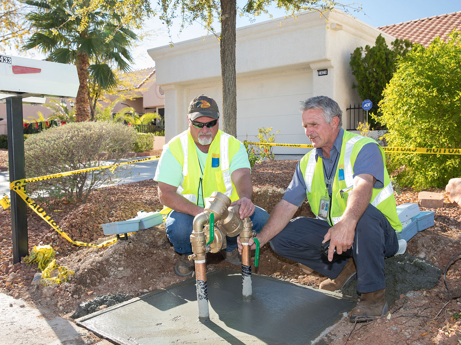 employees working on installing new water meter